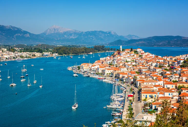 Sailboats at anchor off Poros town in the Saronic Gulf